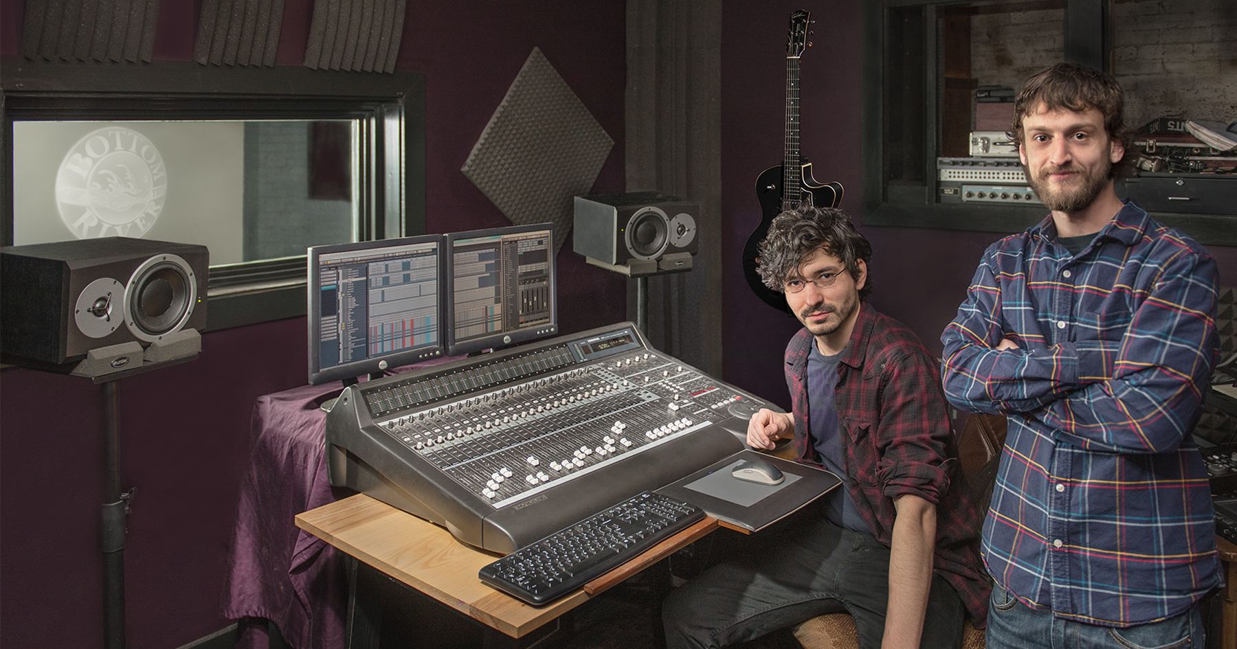 Nick Bilotta and Brian Andrews at the controls of their recording studio in the Pepperell Mill Campus. Photograph by Portland Headshot.